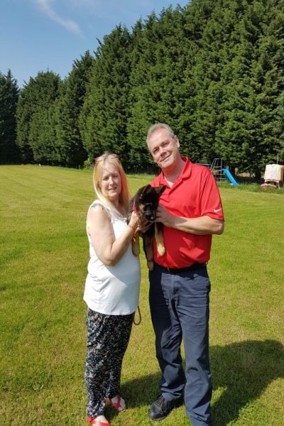 A photograph of the dog trainer collecting his puppy Lexi